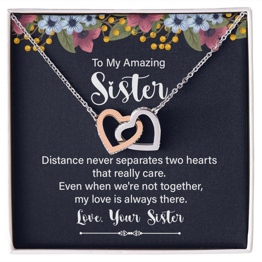 Amazing Sister interlocking hearts necklace in rose gold and silver on To My Amazing Sister message card in white gift box