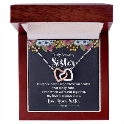 Amazing Sister yellow gold interlocking hearts necklace in open mahogany luxury LED gift box with sentimental sister message