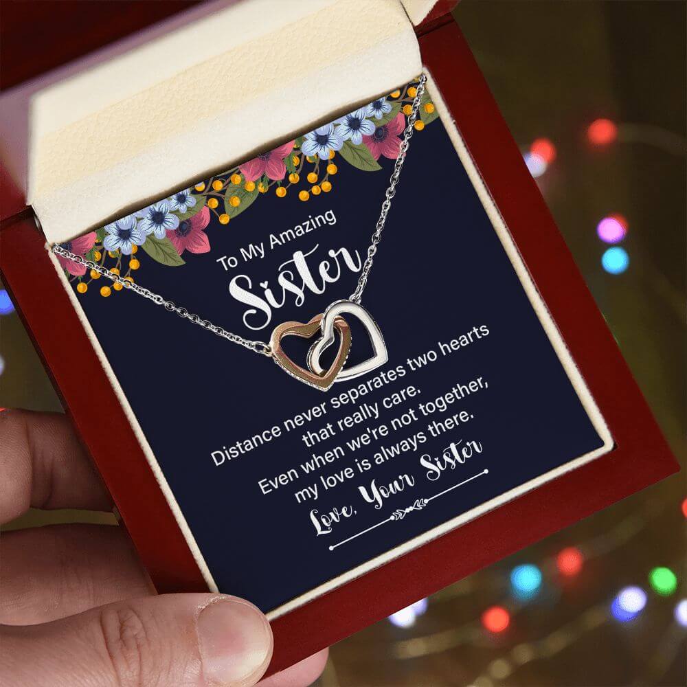 Amazing Sister interlocking hearts necklace in rose gold and silver on To My Amazing Sister message card in white gift box